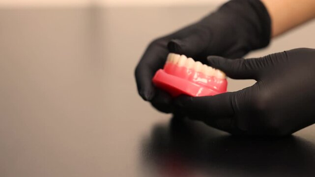 Dental aligners placement on jaw model orthodontic demonstration
