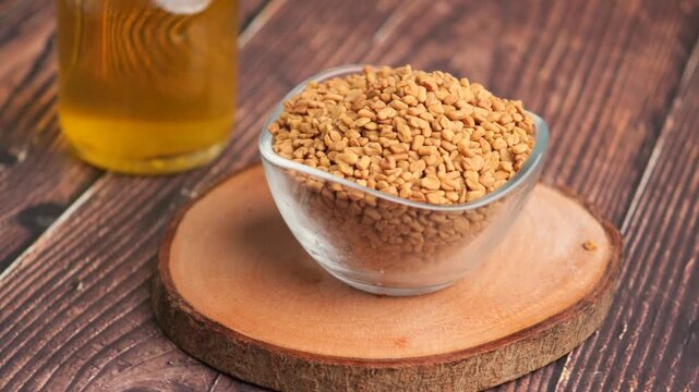 Fenugreek Seeds in a Glass Bowl on a Wooden Table