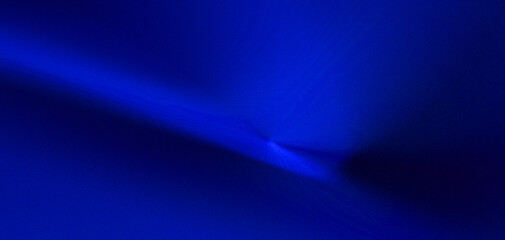 Abstract royal blue background with a "liquid" or "silky" texture and soft-focus lighting effect. © maskam