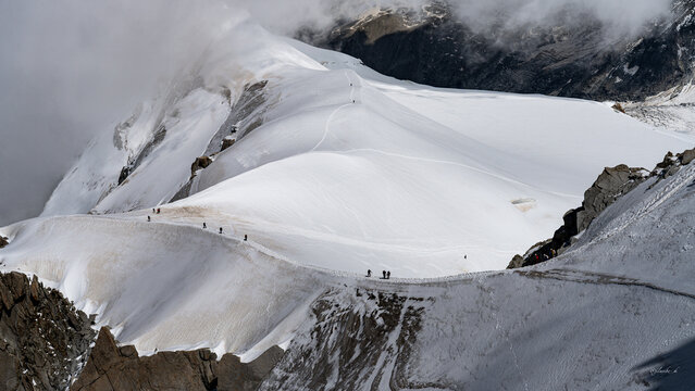 Majestic view of hikers on the snowy ridge of Mont Blanc, Chamonix, France