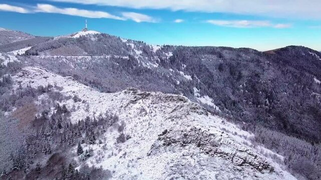 Aerial shot of the Cret de L'Oeillon in the Pilat regional park in winter from the Pic des trois dents on a beautiful day, Pilat Natural regional Park, Loire departement, Auvergne Rhone Alpes region