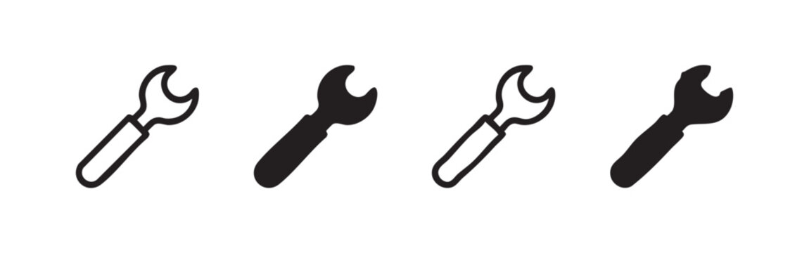 Set of four wrench icons in outline and silhouette styles
