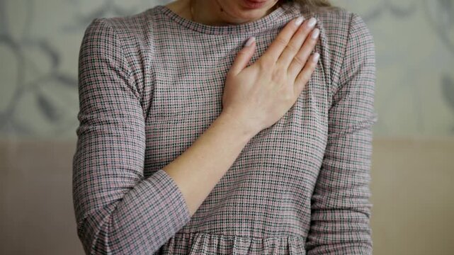 Woman Holding Hand On Chest Feeling Heart. Health Problem. Cardiovascular Disease 
