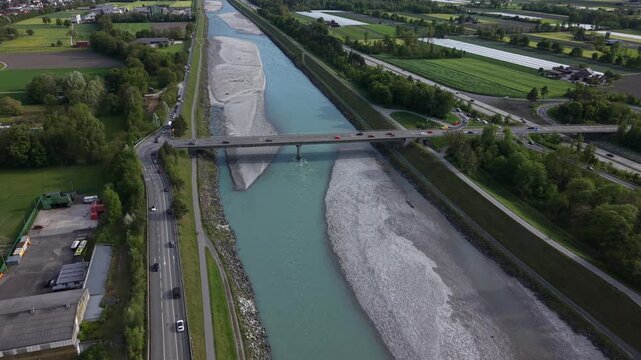 Aerial footage of dense traffic crossing a bridge between countries during peak hours, showing daily commuting and cross-border mobility.