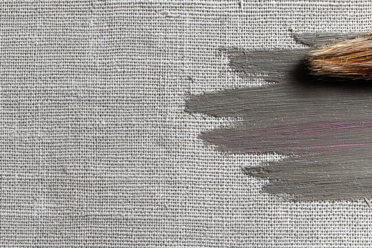 Brush strokes on textured canvas create layered, tactile effect