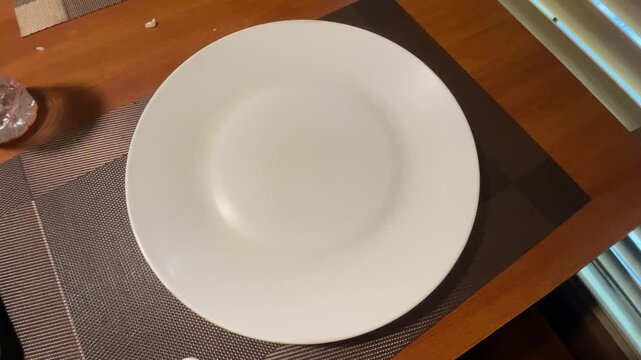 empty plate on wooden table
