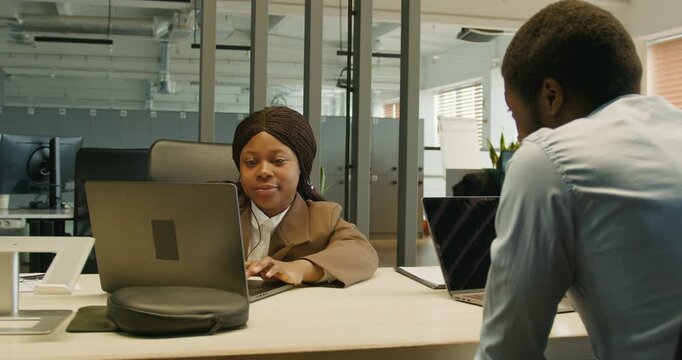 Product creator showcases visual prototype to eager colleague in studio