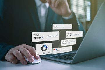 Obraz premium Businessman analyzing social media analytics dashboard on laptop showing views, followers, engagement growth. digital marketing strategy, social media performance tracking, online business growth.