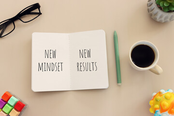 Naklejka premium image of notebook with the text new mindset. success and personal development concept