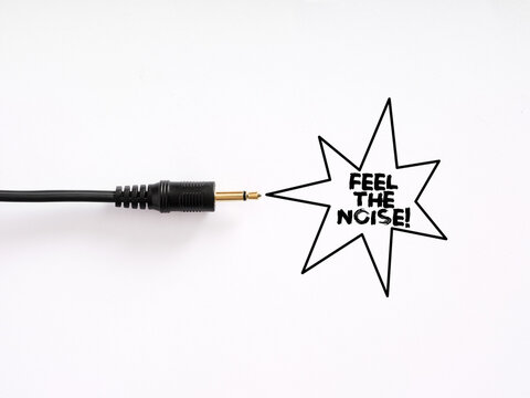 Audio jack cable connecting to feel the noise text in speech bubble