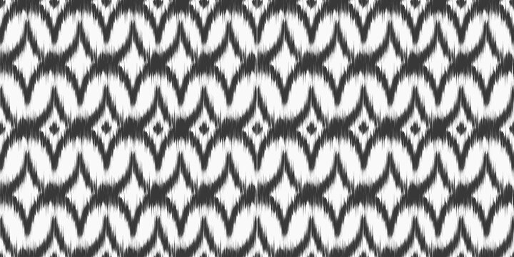 Ikat ethnic seamless pattern with abstract print. Vector ornamental background with rug texture for textile decor. Retro monochrome rhombus decoration with dye effect