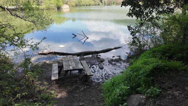 Scenic View of Karagol Nature Park Lake with Picnic Tables and Lush Trees in Izmir, Turkey. High quality 4k footage