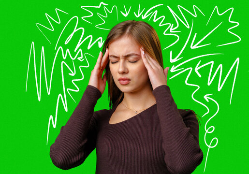 Woman holds her head in pain against bright green background filled with lines in a chaotic pattern