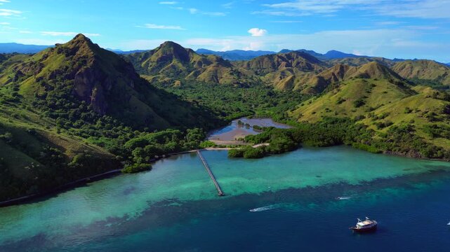 Komodo island landscape with boats in turquoise water. Perfect aerial view drone