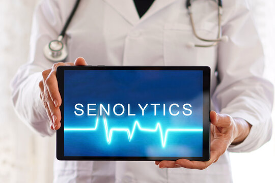 senolytics. Healthcare professional holding a digital tablet. Longevity medicine concept.