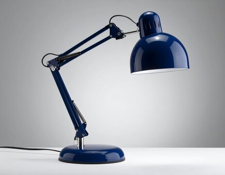 The sophisticated navy blue and chrome desk lamp dimmer knob stands isolated on a minimalist light surface