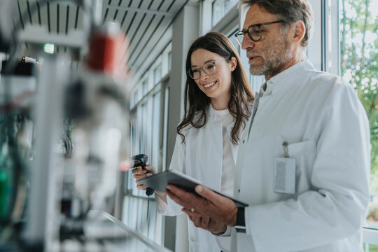 Scientist and researcher analyzing measurement data in laboratory