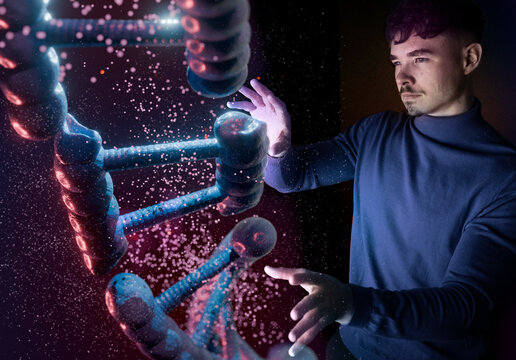 Engineer interacting with futuristic DNA hologram in dark laboratory