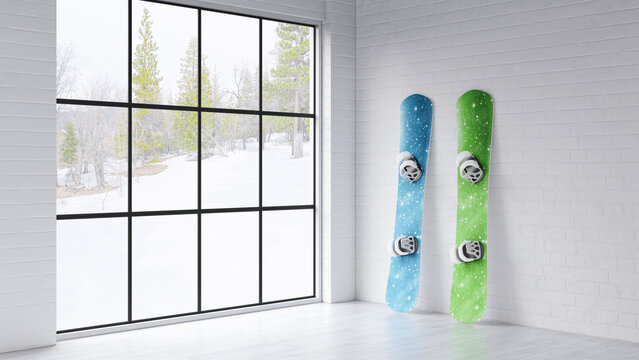Two snowboards leaning against a white wall indoors near a window