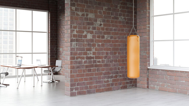 Orange punching bag in an empty modern office break room