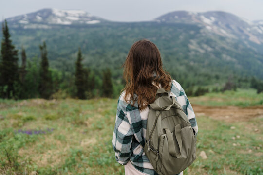 Tourist with backpack enjoying the landscape at Mountain Zelenaya