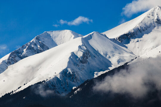 Winter sunrise over Vihren and Kutelo peaks in Pirin Mountains