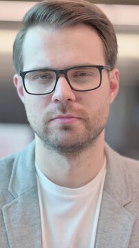 Portrait of Casual Man Looking at Camera