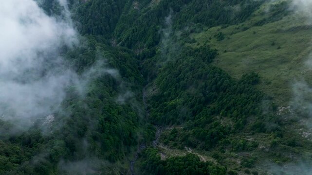 Aerial view misty foggy mountain landscape with clouds