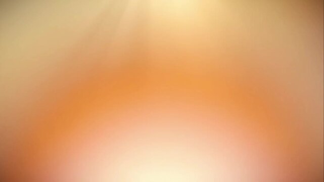 Radiant warm orange and yellow gradient background with soft glowing light rays and bokeh effect for serene atmosphere concept and positive energy