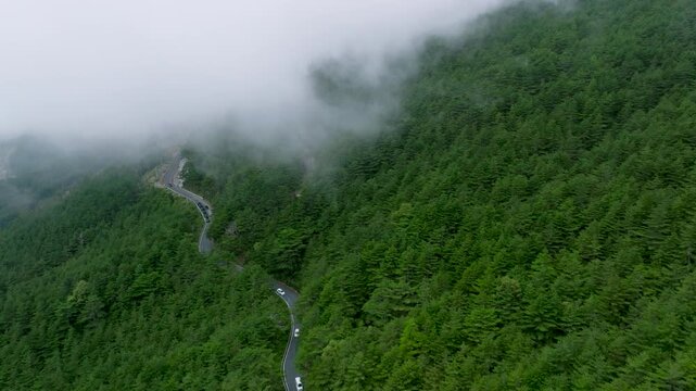 Aerial view misty foggy mountain landscape with clouds