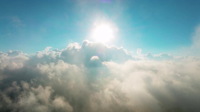 Aerial view above the sea of ​​clouds with the sunset