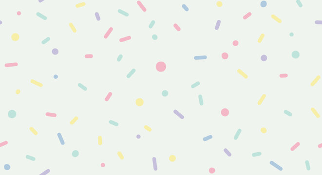 Colorful sprinkles on white background.