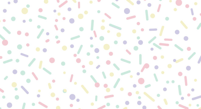 Colorful sprinkles on white background.