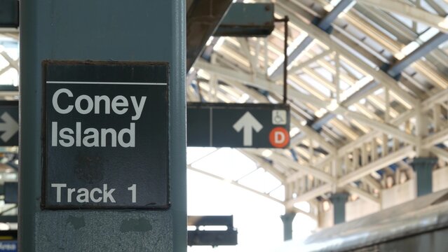 New York City Brooklyn subway outdoor station platform, Coney island elevated metro, Brighton Beach, United States railway. Public metropolitan transport in USA, american railroad. Sign on column