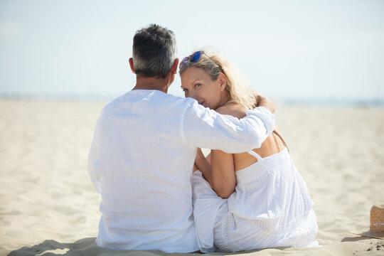 a senior couple enjoying beach holiday