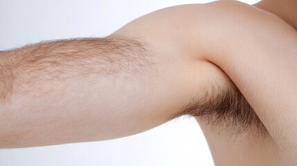 Fototapeta premium Manly hairy arm with smooth skin background highlighting perfect hygiene and underarm perspective.