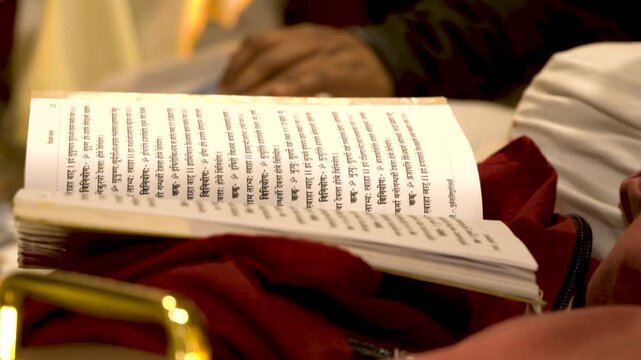 Pandit Ji Chanting Mantras from Sacred Book During Wedding Ritual