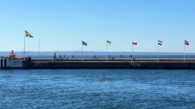 Set of European flags in the wind in Helsingborg port, Sweden
