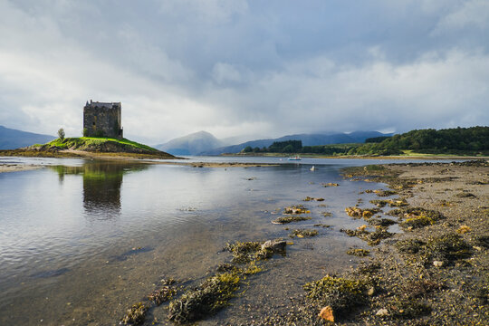 Scenic view of a castle on a loch in the Scottish Highlands