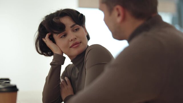 Happy Couple Engaged in Loving Conversation During a Casual Cafe Date