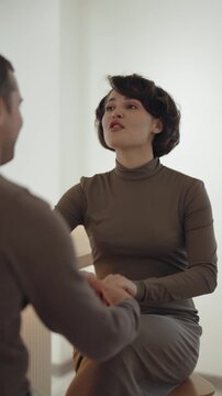 Happy Woman Engaged in Cheerful Conversation with Man, Sharing a Joyful Moment Together