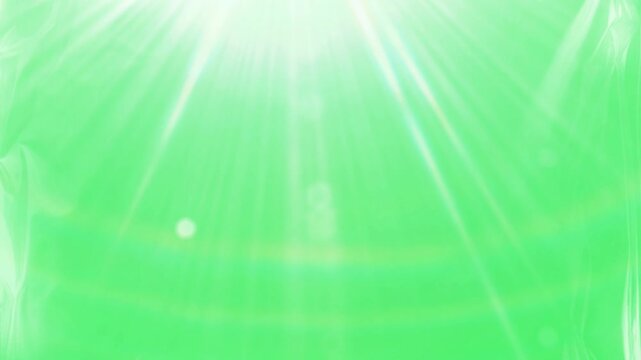 Vibrant green background with radiant white light beams and blue accents abstract dynamic motion video clip