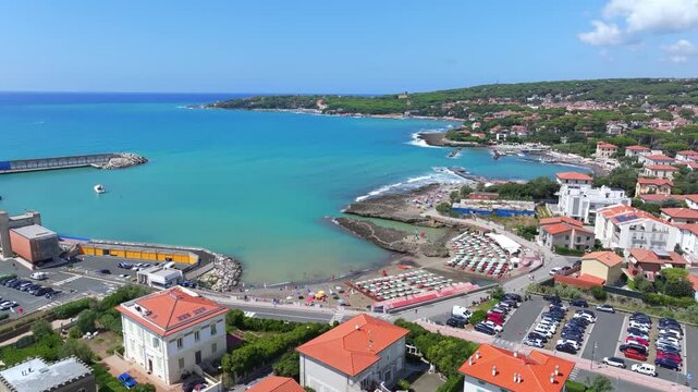 coastal downtown riviera of Castiglioncello looking out to sea from drone perspective, gorgeous blue, green waters serve as a focal point