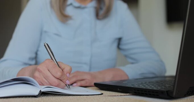 Hand and writing with senior woman in home. Contract, laptop and will with old person in retirement apartment for budget, bank finance.