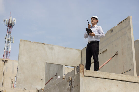 A construction manager inspects a building site