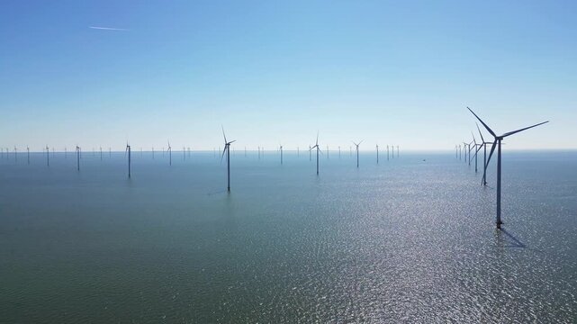 Alternative energy sources, wind turbines produce energy in the north sea, wind farm power plant view from height, green energy.