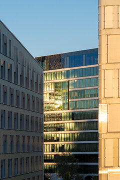 Glass reflection on modern office facade highlights minimal architecture detail in blue urban light for corporate design and clean abstract use