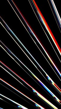 Diagonal glass lines with light diffraction and rainbow prisms creating a sense of speed and data transmission for telecommunications themes
