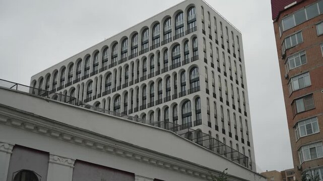  The facade of a building with unusual windows in the center of Moscow. Dolly camera