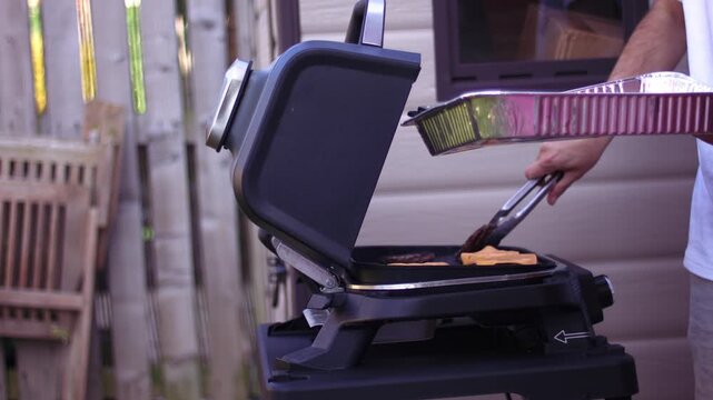 Cooking burger and cheese on a barbecue